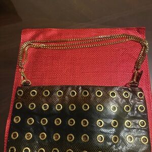 LOGO by Lori Goldstein Black and Gold Eyelet Clutch